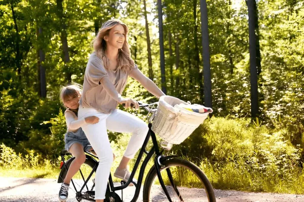 A woman and a child ride on a 2 seater ebike