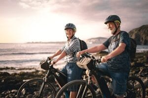 Elderly man and woman each ride best electric bike for seniors