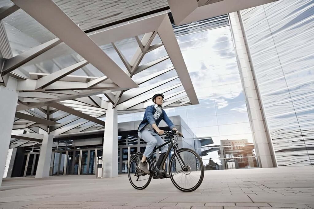 A person is riding commuter electric bike on a city street