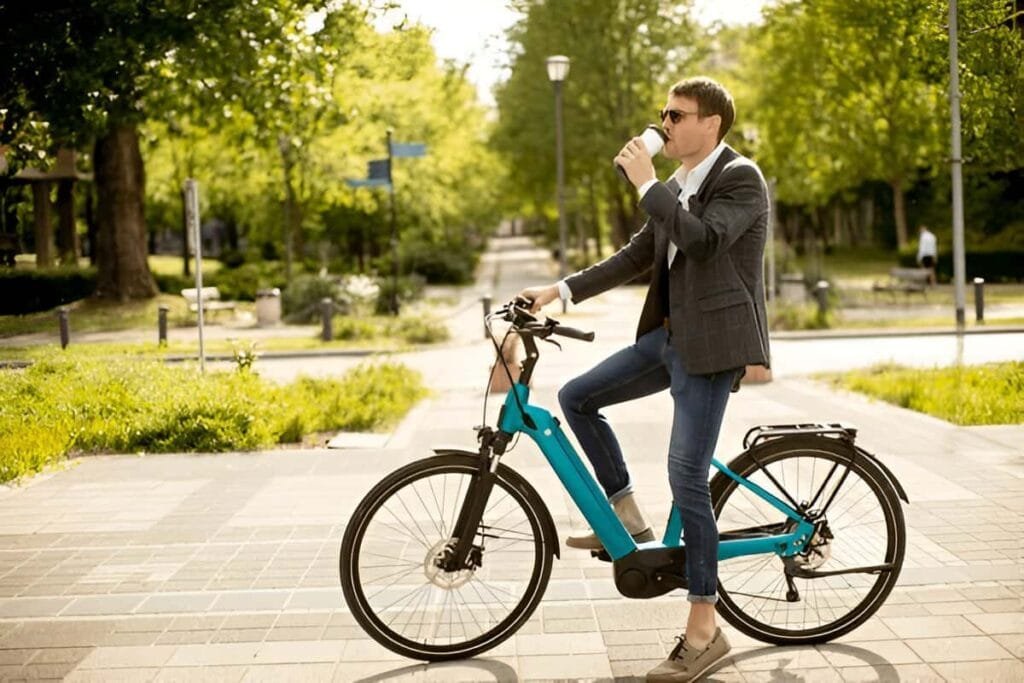 A man commuting on a ancheer electric bike on a city street
