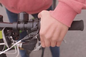 A person applying shimano ebike brakes with their hand