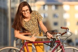 A women holding a U-shaped kryptonite ebike lock