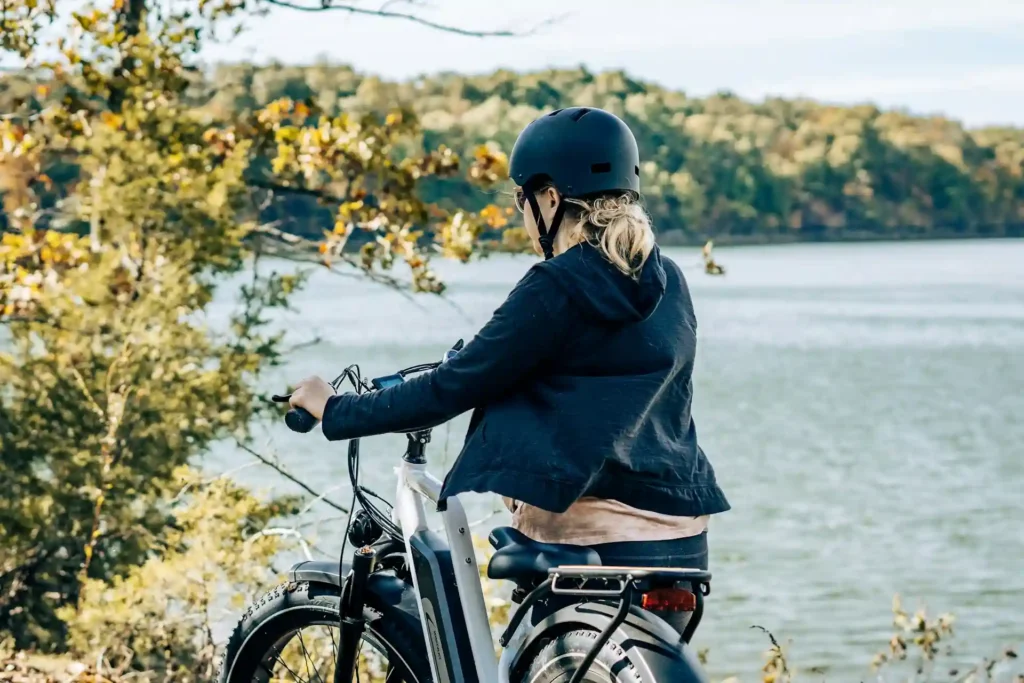 A lady riding with one of e bike helmets