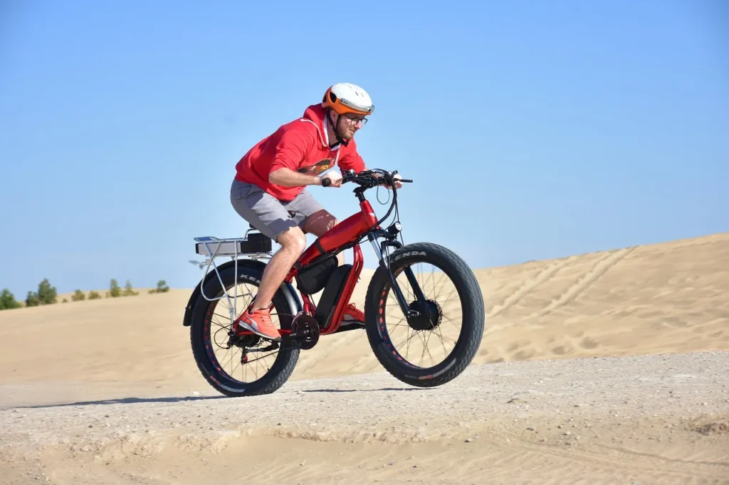 A man is riding with an e bike helmet on
