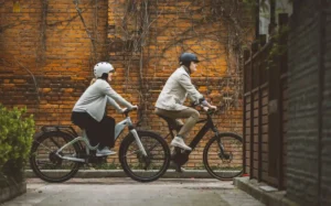 A couple riding with e bike helmet on