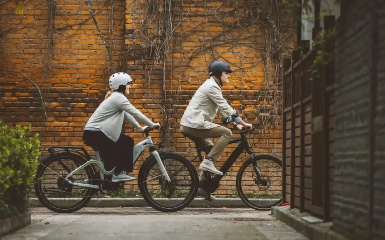 A couple riding with e bike helmet on
